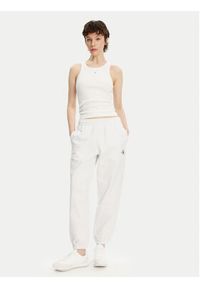 Calvin Klein Jeans Spodnie dresowe Monologo LV047B235G Biały Regular Fit. Kolor: biały. Materiał: bawełna