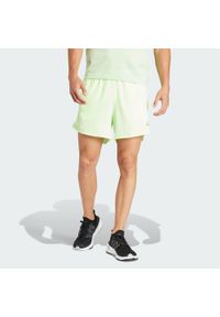 Adidas - Szorty Run It. Kolor: zielony. Materiał: materiał. Sport: bieganie