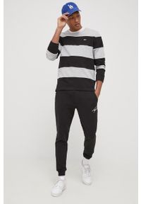 Tommy Jeans Spodnie męskie kolor czarny z aplikacją. Kolor: czarny. Materiał: materiał, włókno, dzianina. Wzór: aplikacja