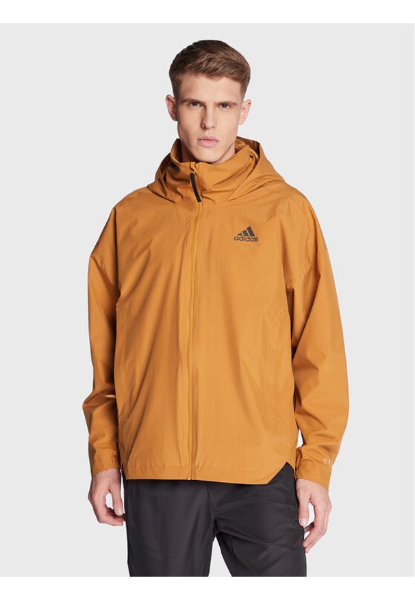 Adidas - adidas Kurtka przejściowa Traveer RAIN.RDY Jacket (Gender Neutral) HG6013 Beżowy Regular Fit. Kolor: beżowy. Materiał: syntetyk