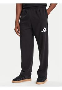 Adidas - adidas Spodnie dresowe Essentials JF3567 Czarny Loose Fit. Kolor: czarny. Materiał: syntetyk, bawełna