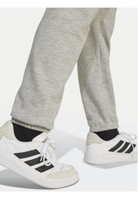 Adidas - adidas Spodnie dresowe Essentials JD2092 Szary Regular Fit. Kolor: szary. Materiał: bawełna