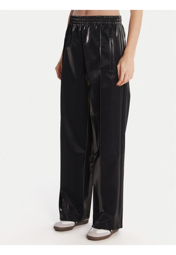 Adidas - adidas Spodnie dresowe adicolor Holiday JV7503 Czarny Loose Fit. Kolor: czarny. Materiał: wiskoza