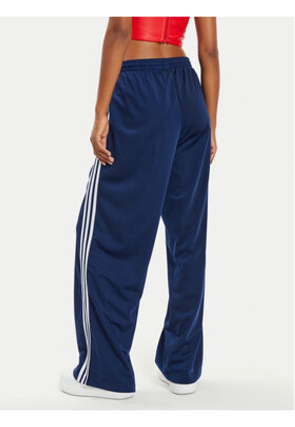 Adidas - adidas Spodnie dresowe Firebird IL3817 Granatowy Loose Fit. Kolor: niebieski. Materiał: syntetyk