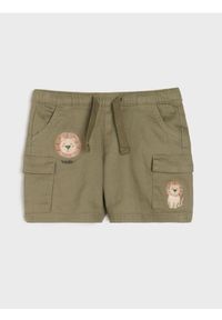 Sinsay - Spodnie jeansowe z kieszeniami cargo - khaki. Kolor: brązowy. Materiał: jeans