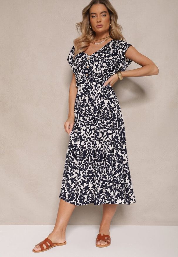 Renee - Granatowa Sukienka z Bawełny Rozkloszowana z Falbanami w Roślinny Wzór Zalimara. Okazja: na co dzień. Typ kołnierza: dekolt w kształcie V. Kolor: niebieski. Materiał: bawełna. Długość rękawa: krótki rękaw. Styl: casual, klasyczny