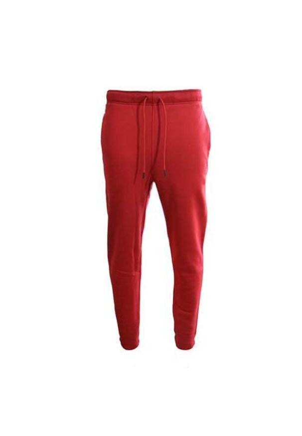 Spodnie sportowe męskie Nike DA9820687. Kolor: czerwony. Materiał: dresówka. Sport: bieganie