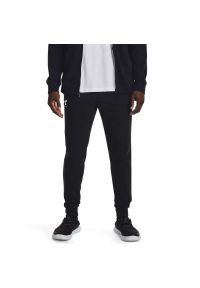 Under Armour UA RIVAL TERRY JOGGER Spodnie dresowe męskie. Okazja: na co dzień. Kolor: czarny. Materiał: dresówka. Wzór: gładki. Styl: sportowy, klasyczny, casual #1