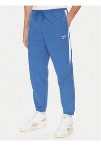 Reebok Spodnie dresowe 100215278 Niebieski Regular Fit. Kolor: niebieski. Materiał: syntetyk