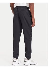 Under Armour Spodnie dresowe Unstoppable 6003861 Czarny Loose Fit. Kolor: czarny. Materiał: syntetyk #3