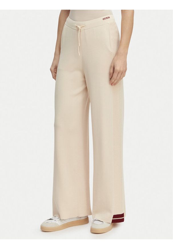 Guess Spodnie dresowe V6GB06 Z0651 Beżowy Wide Leg. Kolor: beżowy. Materiał: syntetyk