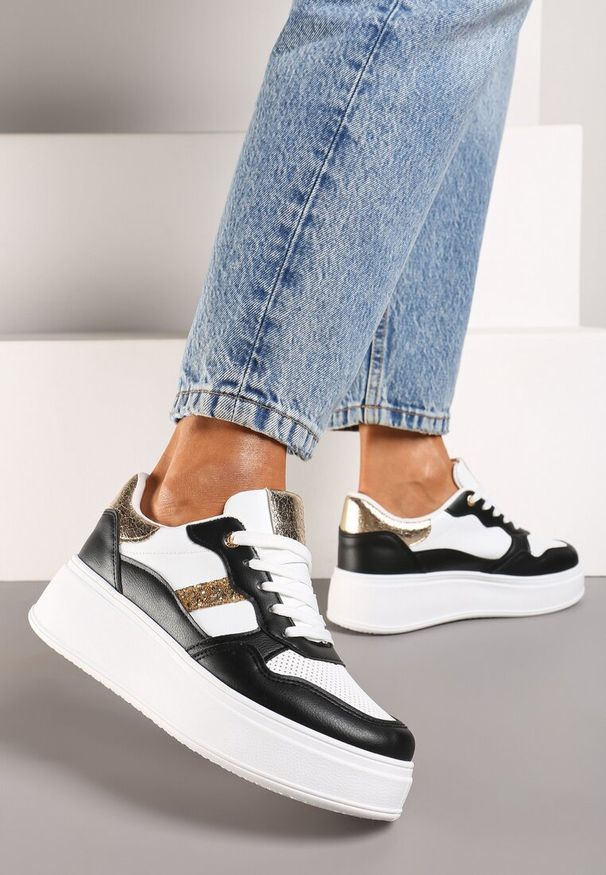 Renee - Czarno-Białe Sneakersy z Ekoskóry za Kostkę ze Sznurowaniami Zdobione Perforacją Raviana. Wysokość cholewki: za kostkę. Nosek buta: okrągły. Zapięcie: sznurówki. Kolor: czarny. Wzór: aplikacja. Obcas: na obcasie. Wysokość obcasa: niski