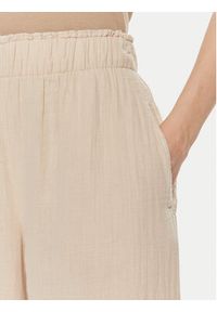 GAP - Gap Spodnie materiałowe 855967-01 Beżowy Relaxed Fit. Kolor: beżowy. Materiał: bawełna