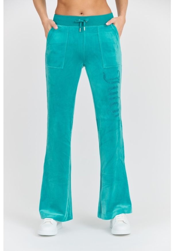 Juicy Couture - JUICY COUTURE Damskie turkusowe spodnie desowe Layla Jewelled Low Rise Pant. Kolor: niebieski. Materiał: materiał, poliester, elastan