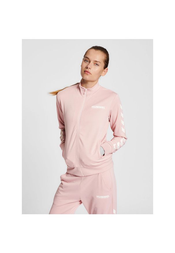 Damska bluza dresowa zapinana na zamek Hummel Legacy. Kolor: biały. Materiał: dresówka. Sport: piłka ręczna