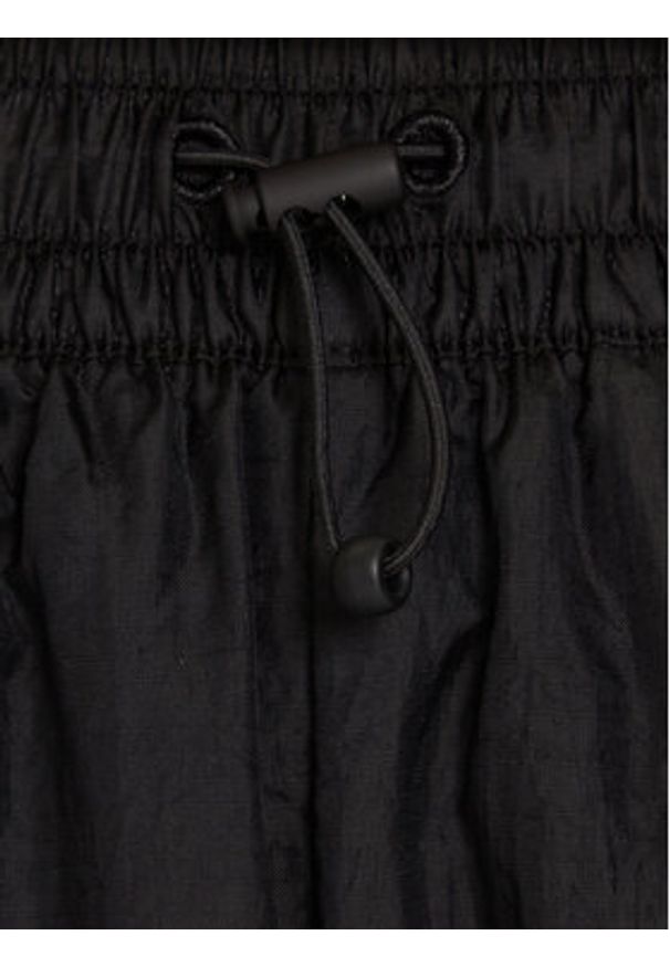 Puma Spodnie dresowe PUMA X ROSÉ T7 633796 01 Czarny Relaxed Fit. Kolor: czarny. Materiał: syntetyk