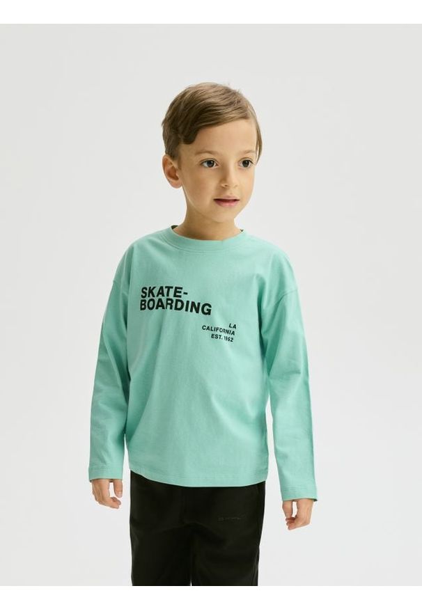 Reserved - Bawełniany longsleeve - jasnoturkusowy. Kolor: turkusowy. Materiał: bawełna. Długość rękawa: długi rękaw