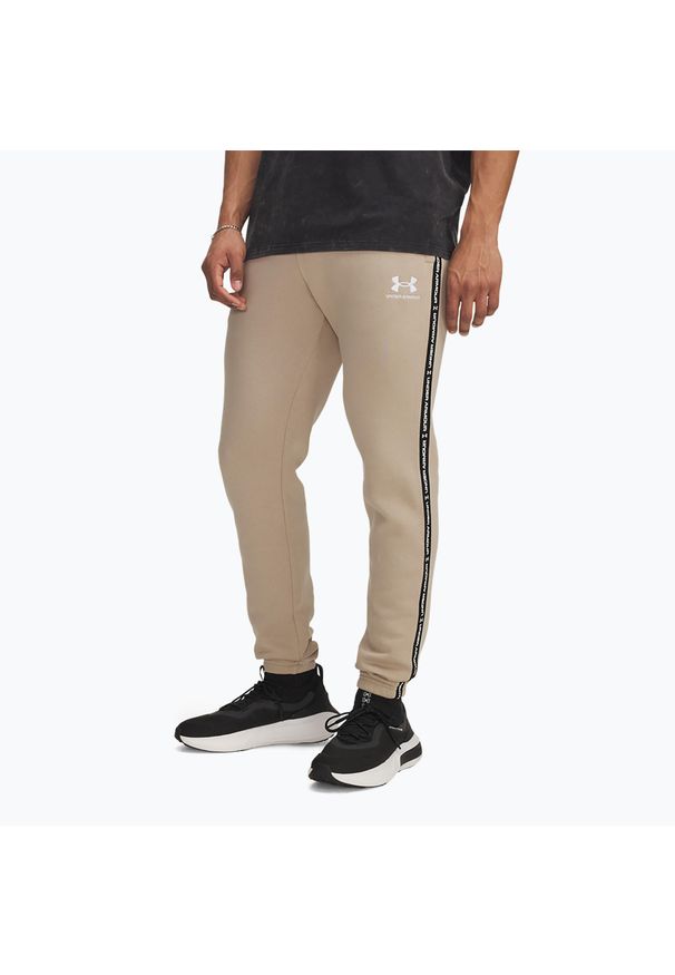 Spodnie męskie Under Armour Icon Fleece Jgr city. Kolor: beżowy. Sport: fitness