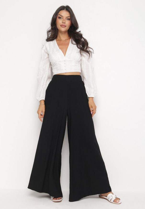 Born2be - Czarne Szerokie Spodnie z Gumką w Pasie i Kieszeniami przy Biodrach Boulia. Kolor: czarny