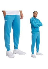 Spodnie dresowe męskie Under Armour joggery. Kolor: niebieski. Materiał: dresówka. Sport: fitness