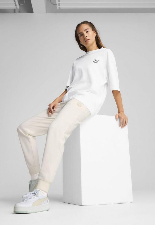 Puma - Damskie spodnie dresowe ESS ELEVATED PUMA No Dye Color Mix. Materiał: dresówka