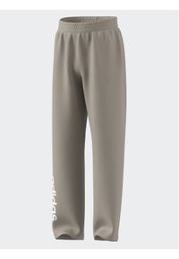 Adidas - adidas Spodnie dresowe IB3234 Beżowy Loose Fit. Kolor: beżowy. Materiał: bawełna #1