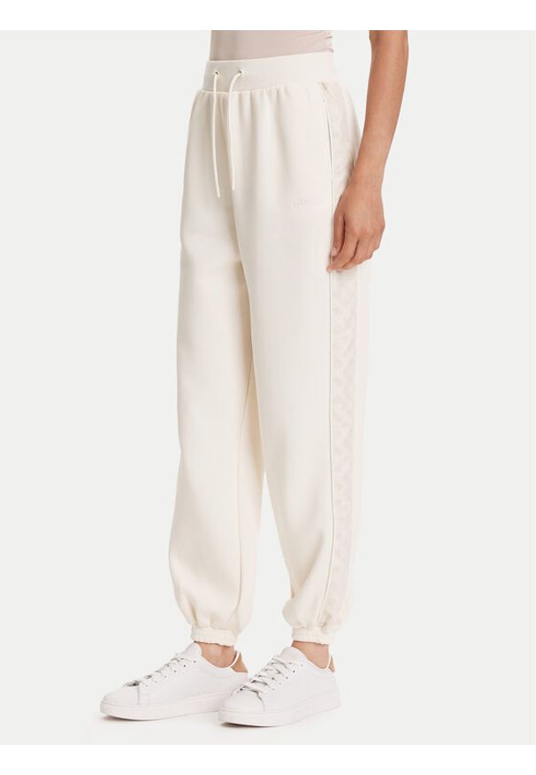 Guess Spodnie dresowe V5YB02 KB3P2 Écru Regular Fit. Materiał: syntetyk