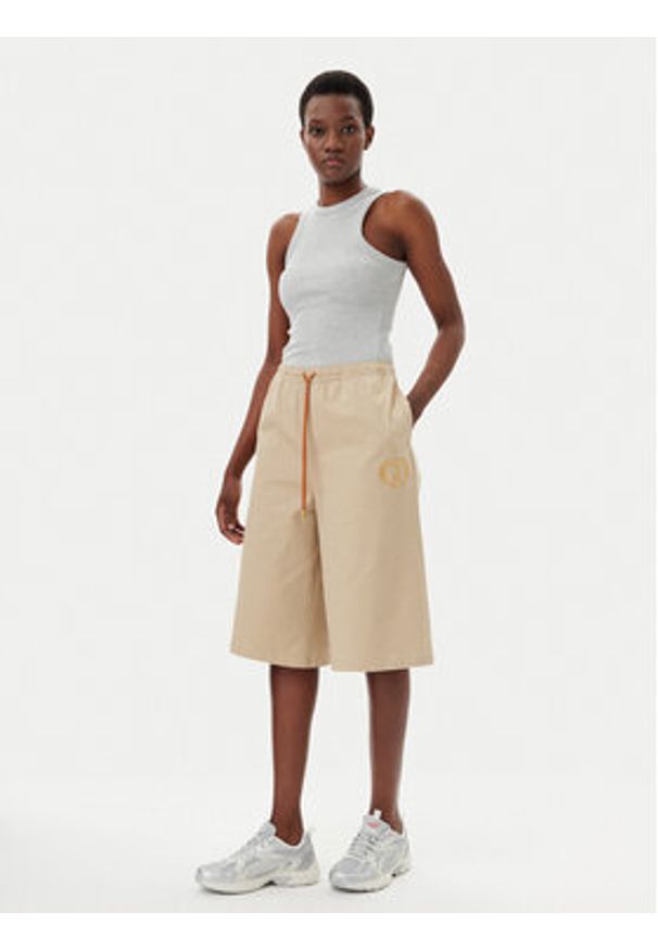 Puma Szorty sportowe Harry Potter 630098 Beżowy Relaxed Fit. Kolor: beżowy. Materiał: bawełna