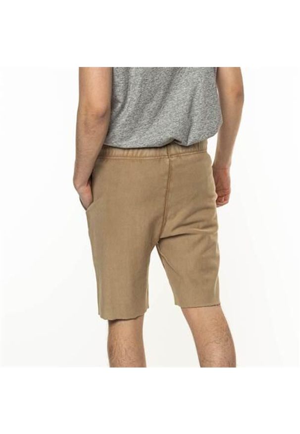 Spodnie treningowe męskie Champion 217665MS008KEB. Kolor: biały. Długość: krótkie. Sezon: lato