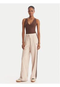 Adidas - adidas Spodnie dresowe Terry Towel Firebird KQ6661 Beżowy Loose Fit. Kolor: beżowy. Materiał: bawełna #2