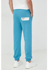 United Colors of Benetton spodnie dresowe bawełniane męskie kolor niebieski z nadrukiem. Kolor: niebieski. Materiał: bawełna, dresówka. Wzór: nadruk #2