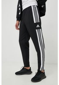 adidas Performance spodnie męskie kolor czarny gładkie. Kolor: czarny. Materiał: tkanina, poliester, skóra, materiał. Wzór: gładki. Sport: fitness #3