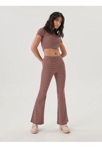 Sinsay - Spodnie flare high waist - czarny. Stan: podwyższony. Kolor: czarny. Materiał: dzianina. Styl: elegancki
