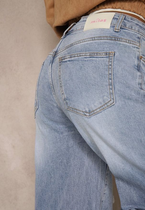 Renee - Niebieskie Jeansy High Waist Wide Leg z Ozdobnymi Przetarciami i Dziurami Elintyse. Stan: podwyższony. Kolor: niebieski. Styl: klasyczny