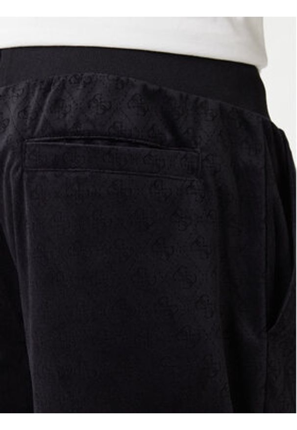 Guess Spodnie dresowe Z6RB14 KD612 Czarny Regular Fit. Kolor: czarny. Materiał: syntetyk
