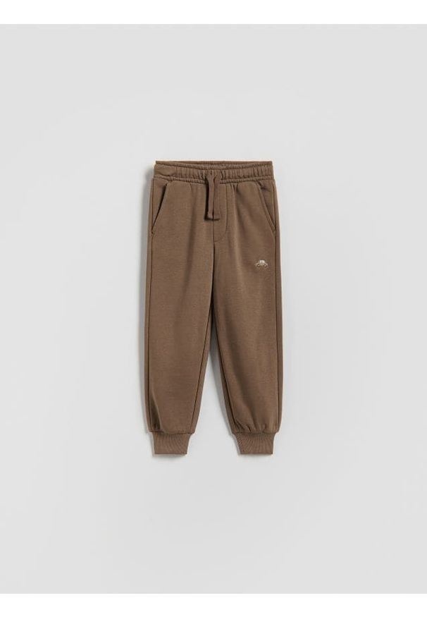 Reserved - Bawełniane spodnie jogger - brązowy. Kolor: brązowy. Materiał: bawełna