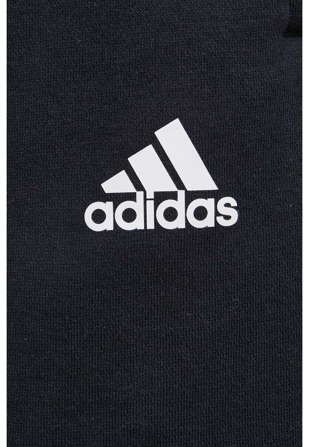 Adidas - adidas spodnie damskie kolor czarny gładkie. Stan: podwyższony. Kolor: czarny. Materiał: materiał, włókno, bawełna, dzianina. Wzór: gładki