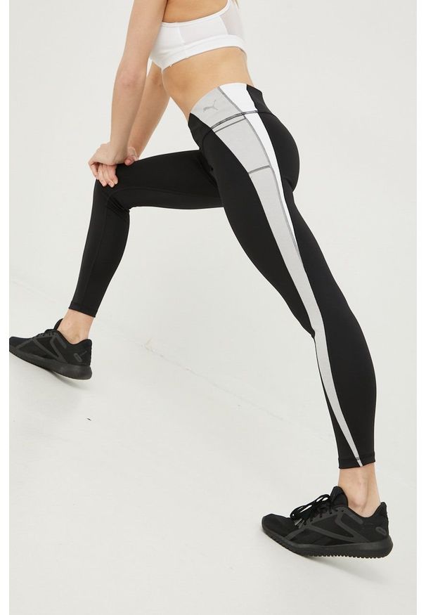 Puma legginsy treningowe Evostripe damskie kolor czarny wzorzyste. Kolor: czarny. Materiał: skóra, materiał. Sport: fitness