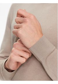 Calvin Klein Sweter K10K109474 Beżowy Regular Fit. Kolor: beżowy. Materiał: wełna