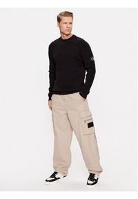 Calvin Klein Jeans Spodnie materiałowe J30J324444 Beżowy Relaxed Fit. Kolor: beżowy. Materiał: bawełna