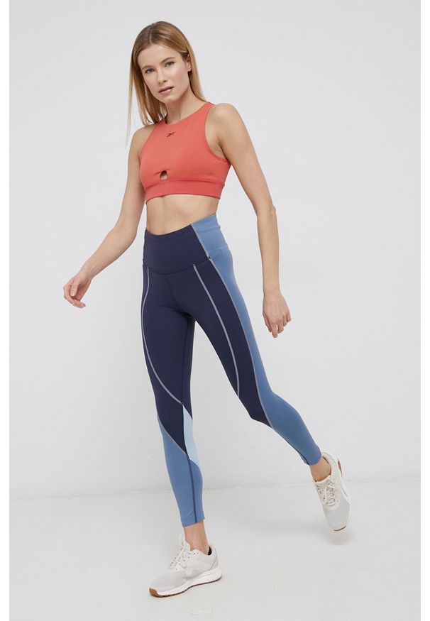 Reebok Legginsy damskie kolor granatowy wzorzyste. Kolor: niebieski. Materiał: dzianina, skóra