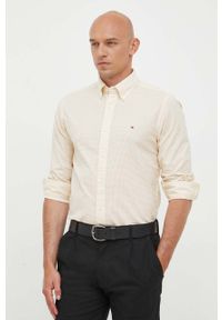 TOMMY HILFIGER - Tommy Hilfiger koszula bawełniana męska kolor beżowy regular z kołnierzykiem button-down. Typ kołnierza: button down. Kolor: żółty. Materiał: bawełna. Długość: długie #1