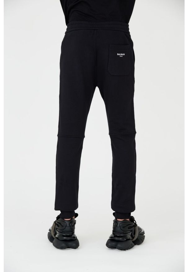 Balmain - BALMAIN Czarne męskie spodnie dresowe Ribbed Flock Sweatpants, Rozmiar L. Kolor: czarny. Materiał: dresówka