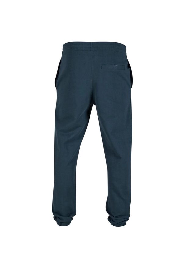 Urban Classics - Męskie Spodnie Do Biegania Ultra Heavy. Kolor: zielony. Długość: długie