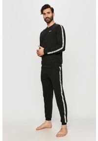 DKNY - Dkny - Spodnie piżamowe. Kolor: czarny. Materiał: bawełna, dzianina. Wzór: aplikacja #2