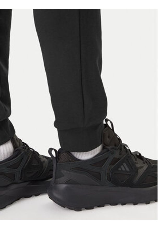 Adidas - adidas Spodnie dresowe Essentials Feel Cozy JE3854 Czarny Regular Fit. Kolor: czarny. Materiał: bawełna