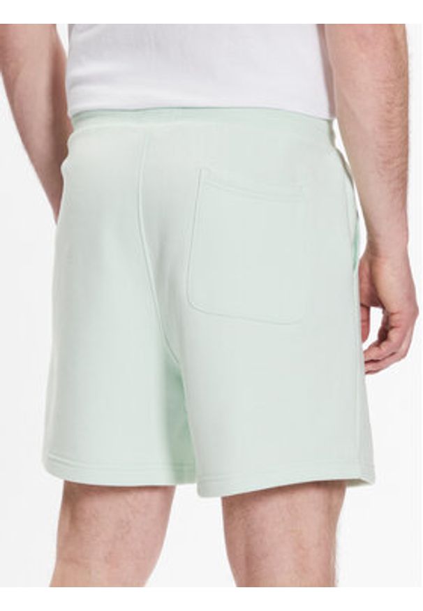 Tommy Jeans Szorty sportowe DM0DM16333 Zielony Regular Fit. Kolor: zielony. Materiał: bawełna, syntetyk. Styl: sportowy