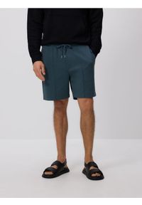Reserved - Szorty comfort z przeszyciami - granatowy. Kolor: niebieski. Materiał: bawełna, dzianina