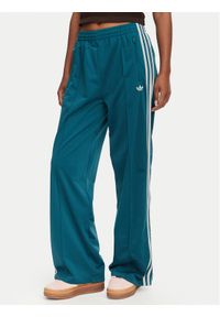 Adidas - adidas Spodnie dresowe Firebird Loose Tracksuit KS4672 Turkusowy Loose Fit. Kolor: turkusowy. Materiał: syntetyk #1