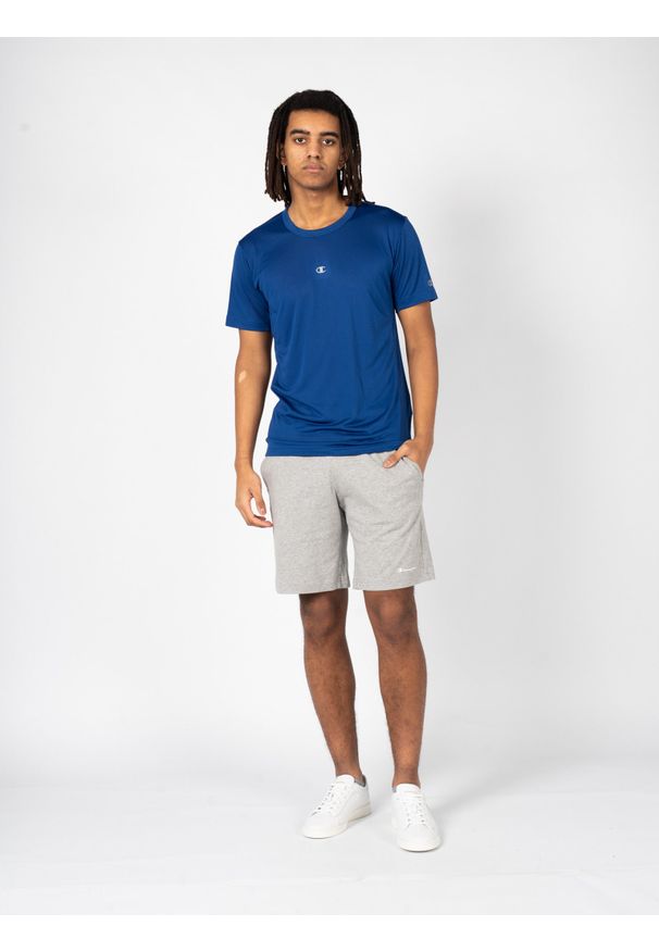 Champion T-Shirt | 218038 | Mężczyzna | Niebieski. Okazja: na co dzień. Kolor: niebieski. Materiał: poliester. Długość rękawa: krótki rękaw. Wzór: nadruk. Styl: klasyczny, casual